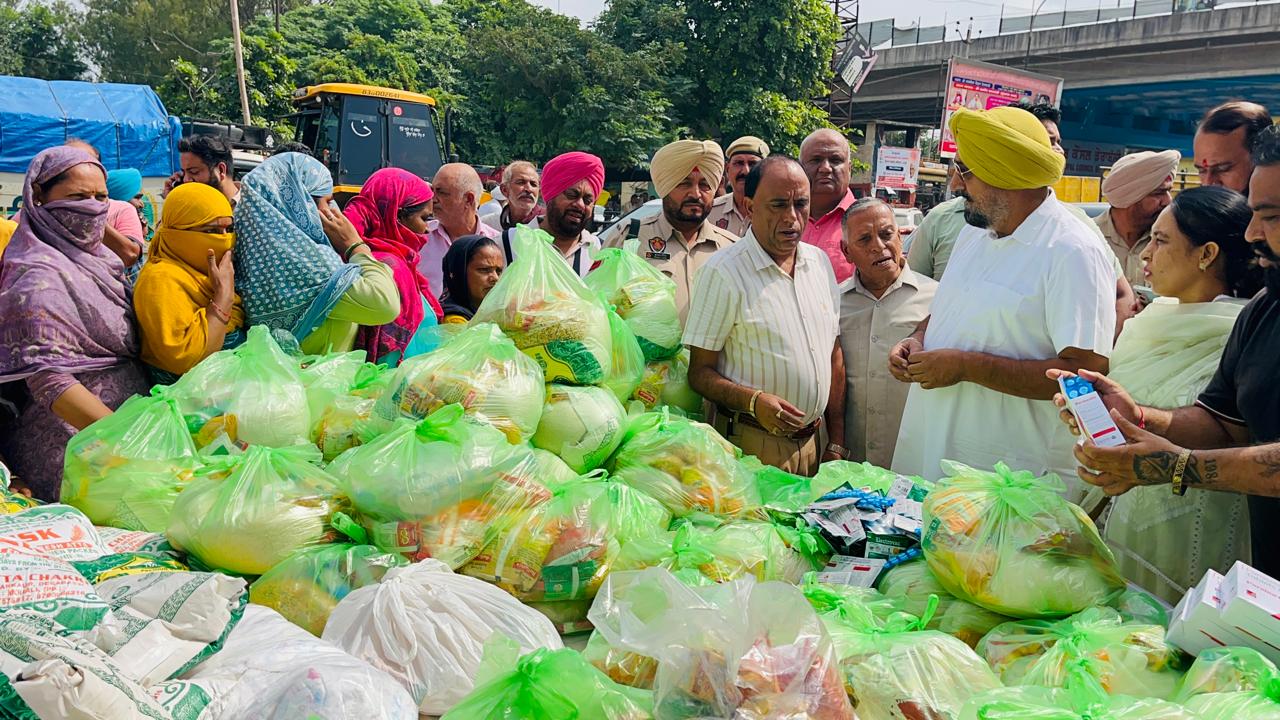 MLA Kuljit Singh Randhawa distributes relief material to rain-affected families at Shri Ram Talai, Derabassi